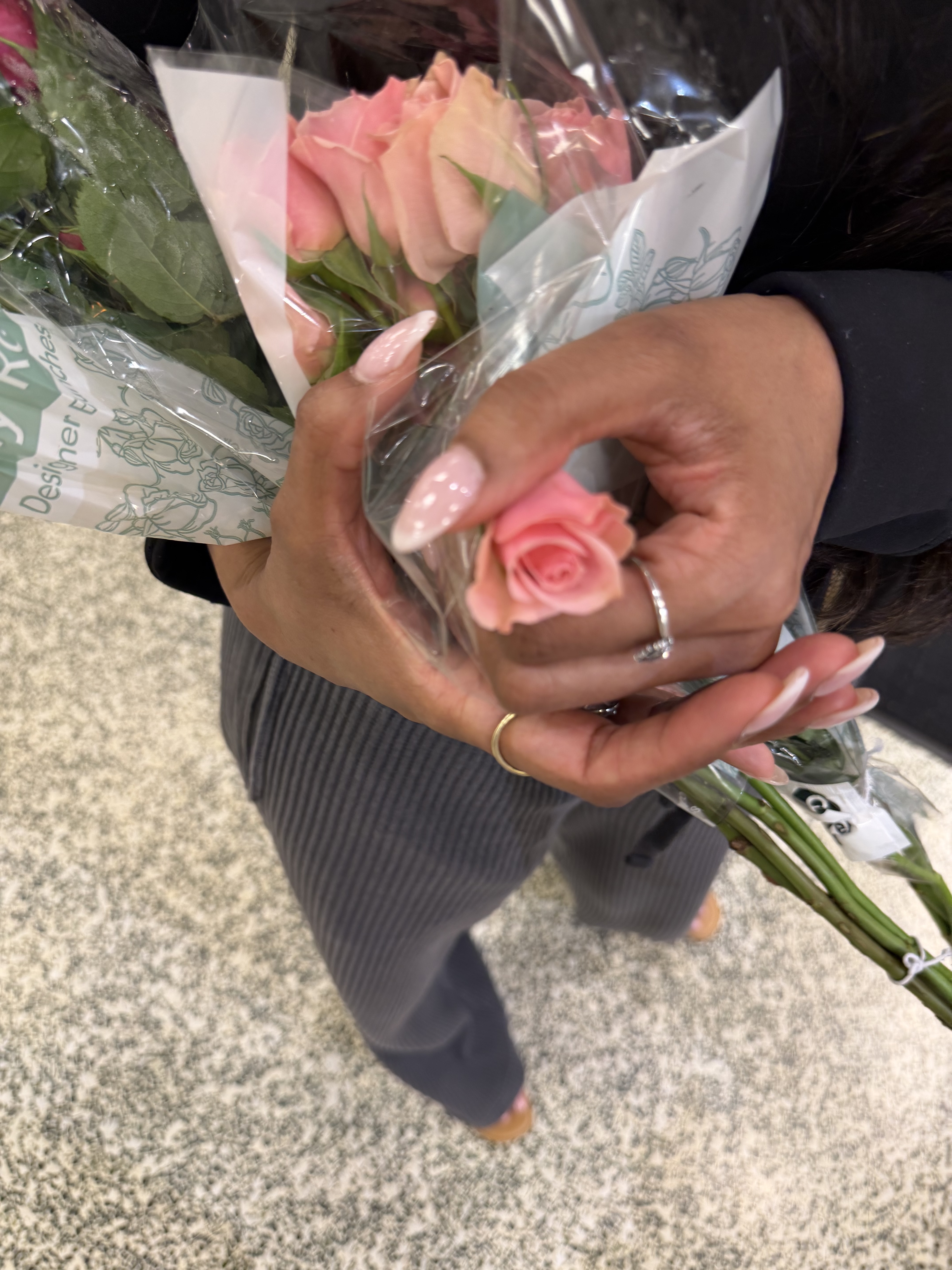 Pink grocery store roses and baby’s breath chosen for bridal wedding hair