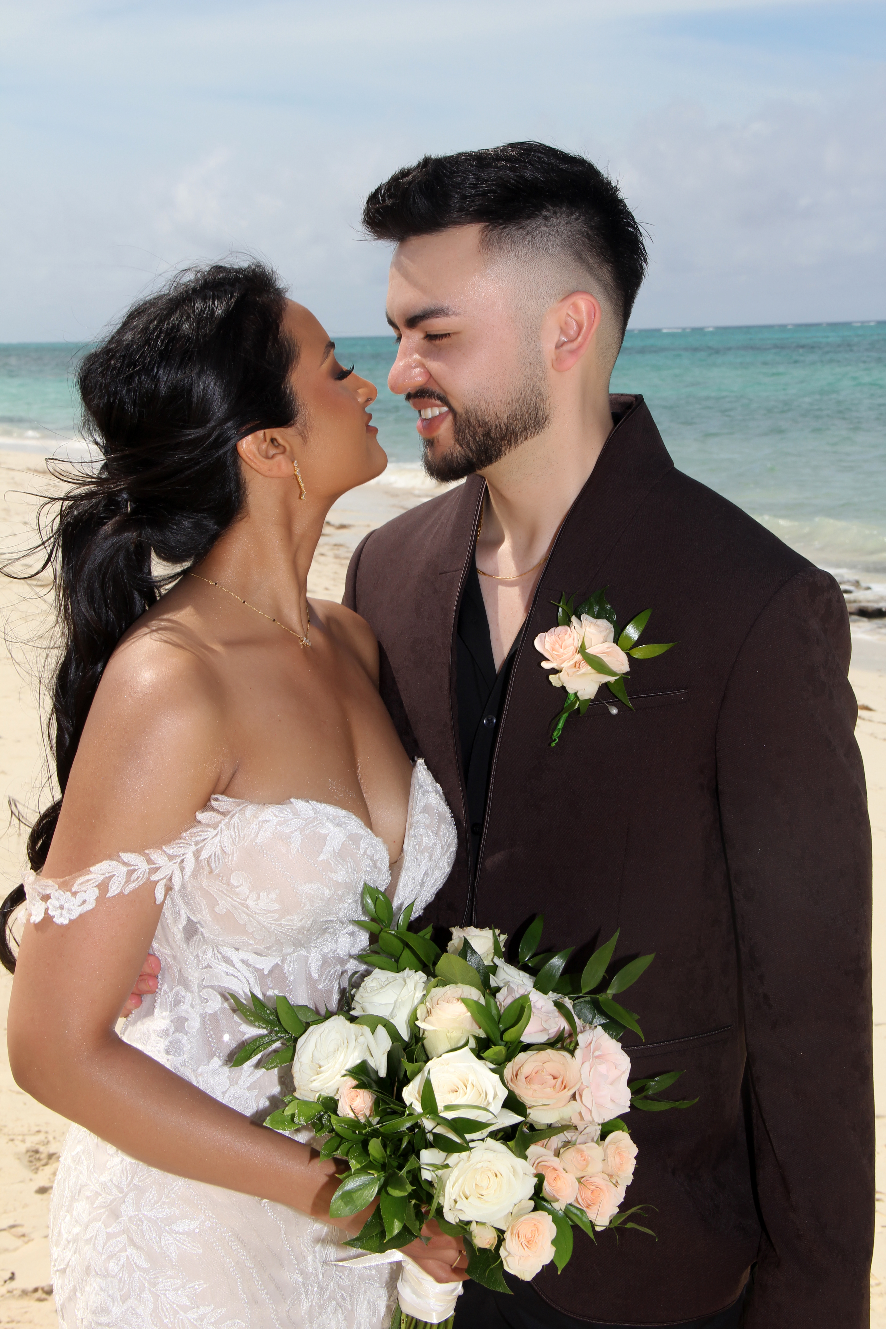 Bride and groom exchanging vows during their beach wedding in Nassau, Bahamas.